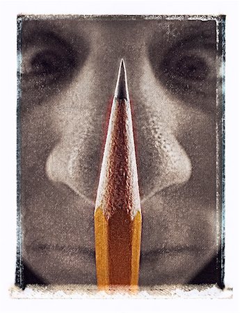 simsearch:700-00044002,k - Close-Up of Man Pressing Pencil Against Nose Fotografie stock - Rights-Managed, Codice: 700-00044646