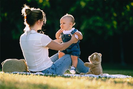 Mother Holding Child Outdoors Fotografie stock - Rights-Managed, Codice: 700-00044885