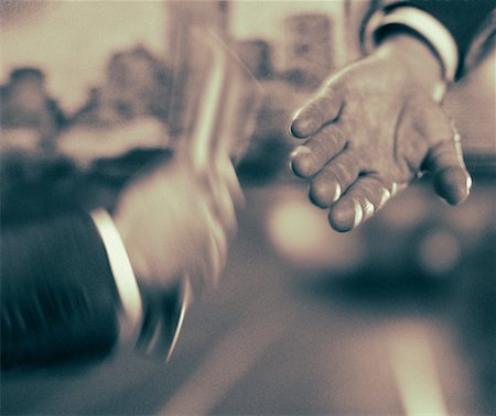 Close-Up of Businessmen's Hands Passing Baton Stock Photo - Rights-Managed, Code: 700-00044954