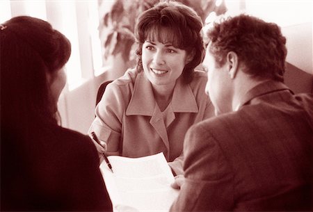 Businesswoman in Meeting with Couple Stock Photo - Rights-Managed, Code: 700-00044985