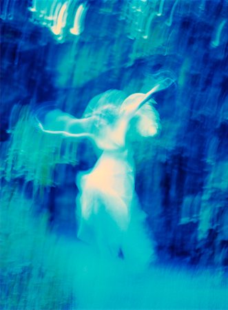 Blurred Woman Dressed as Angel in Forest Stock Photo - Rights-Managed, Code: 700-00045046
