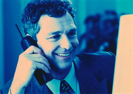 pierre tremblay - Businessman Using Cordless Telephone Foto de stock - Con derechos protegidos, Código: 700-00045097