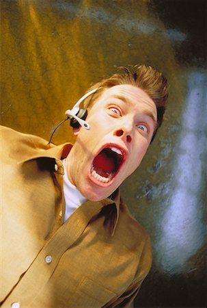 emotional disturbance males - Terrified Man Wearing Telephone Headset Stock Photo - Rights-Managed, Code: 700-00045109