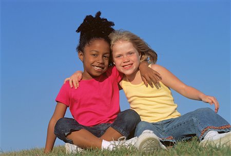 Portrait of Two Girls with Arms Around Each Other Outdoors Stock Photo - Rights-Managed, Code: 700-00045177