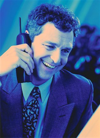 pierre tremblay - Businessman Using Cordless Phone Foto de stock - Con derechos protegidos, Código: 700-00045307