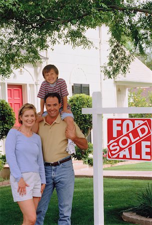 Portrait of Family in Front of House with Sold Sign Stock Photo - Rights-Managed, Code: 700-00045603