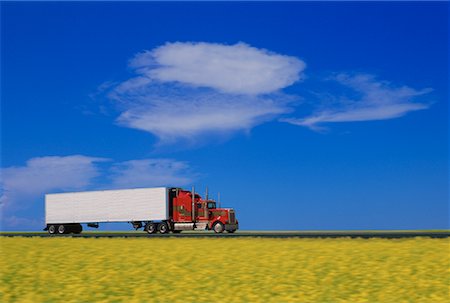 Transport Truck near Canola Field Strathmore, Alberta, Canada Stock Photo - Rights-Managed, Code: 700-00045996