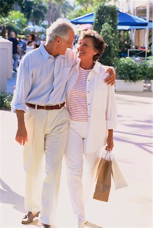 senior couple shopping outside - Mature Couple Walking Outdoors With Shopping Bags Stock Photo - Rights-Managed, Code: 700-00046106