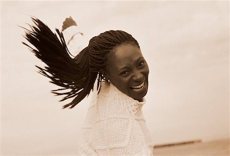 Woman Smiling on Beach Stock Photo - Rights-Managed, Code: 700-00046298