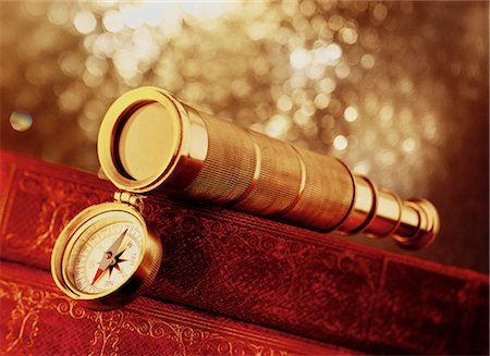 Telescope and Compass on Stack of Books Fotografie stock - Rights-Managed, Codice: 700-00046397