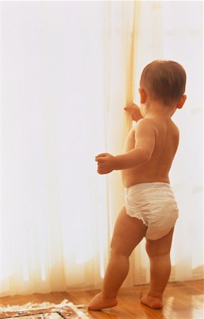 people peeking curtain - Child in Diapers Looking Out of Window Stock Photo - Rights-Managed, Code: 700-00046668