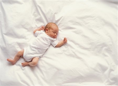 sleeping bed full body - Baby Sleeping Stock Photo - Rights-Managed, Code: 700-00046671