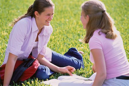 Teenage Girls Sitting on Grass Talking Stock Photo - Rights-Managed, Code: 700-00046836