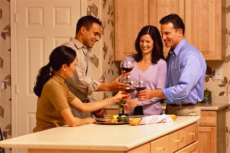 simsearch:700-00153257,k - Couples Drinking Wine in Kitchen Stock Photo - Rights-Managed, Code: 700-00046899