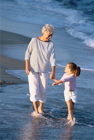 simsearch:700-00062714,k - Grandmother and Granddaughter Walking in Surf on Beach Stock Photo - Rights-Managed, Code: 700-00046925