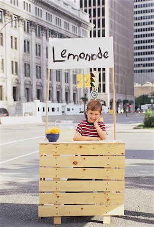 sell lemonade - Boy with Lemonade Stand in Business District Stock Photo - Rights-Managed, Code: 700-00047049