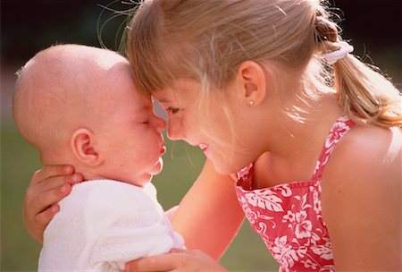 simsearch:700-00047419,k - Girl Holding Baby Stock Photo - Rights-Managed, Code: 700-00047420