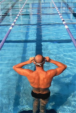 peter griffith - Back View of Man Standing in Swimming Pool Stock Photo - Rights-Managed, Code: 700-00047499