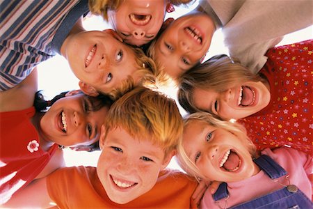 Group Portrait of Children in Huddle Outdoors Stock Photo - Rights-Managed, Code: 700-00047578