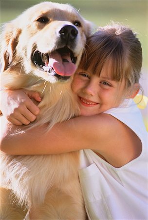 emotional golden retriever - Portrait of Girl Hugging Dog Outdoors Stock Photo - Rights-Managed, Code: 700-00047572
