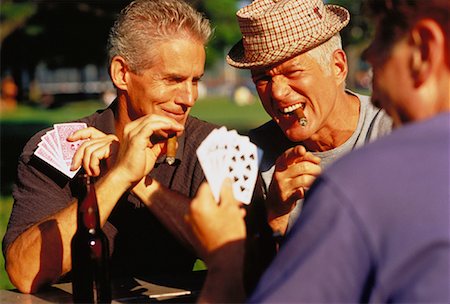 Group of Mature Men Playing Poker Outdoors Stock Photo - Rights-Managed, Code: 700-00047943