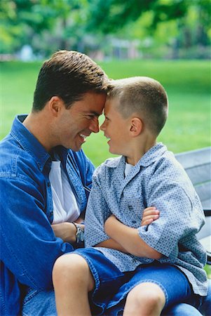 portrait of family on park bench - Father and Son Face to Face Outdoors Stock Photo - Rights-Managed, Code: 700-00047973