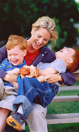 Mother Playing with Sons on Park Bench Stock Photo - Rights-Managed, Code: 700-00048036