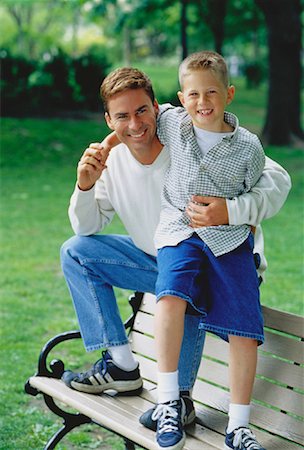 portrait of family on park bench - Portrait of Father and Son on Park Bench Stock Photo - Rights-Managed, Code: 700-00048056