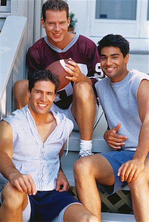 relaxed at home asians in backyard - Group Portrait of Men with Football on Porch Stock Photo - Rights-Managed, Code: 700-00048140