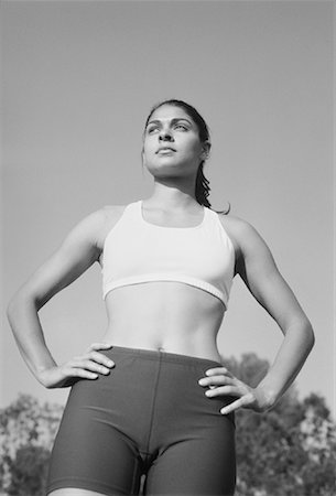 fitness black and white - Woman Resting with Hands on Hips Foto de stock - Con derechos protegidos, Código: 700-00048161