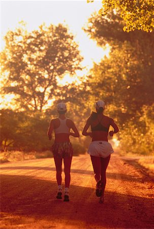 Back View of Women Running Along Road, Boulder, Colorado, USA Stock Photo - Rights-Managed, Code: 700-00048201