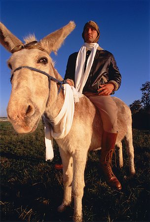Pilot Riding Donkey Stock Photo - Rights-Managed, Code: 700-00048403