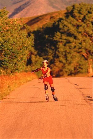 simsearch:700-00029428,k - Woman In-Line Skating on Road Colorado, USA Foto de stock - Con derechos protegidos, Código: 700-00048695