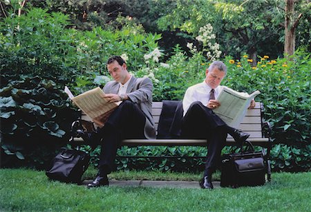 Businessmen Sitting on Park Bench Reading Newspapers Stock Photo - Rights-Managed, Code: 700-00048885
