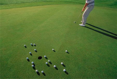 simsearch:700-00528371,k - Golfer Trying to Sink Putt Stock Photo - Rights-Managed, Code: 700-00049195