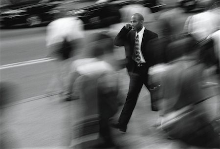 Businessman Using Cell Phone on Crowded Street Stock Photo - Rights-Managed, Code: 700-00049464