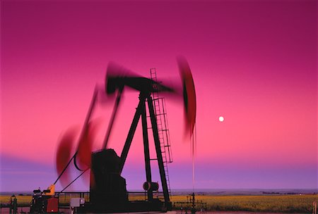 Oil Pump Jacks in Motion at Dusk With Full Moon, Alberta, Canada Stock Photo - Rights-Managed, Code: 700-00049482