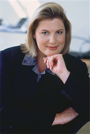 fat corporate woman - Portrait of Businesswoman Resting Head on Hand Stock Photo - Rights-Managed, Code: 700-00049626