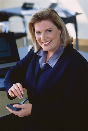 fat corporate woman - Portrait de femme d'affaires utilisant organiseur électronique Photographie de stock - Rights-Managed, Code: 700-00049627