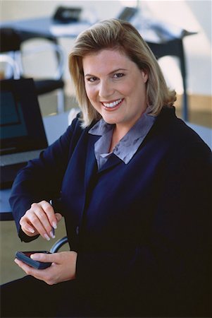 fat corporate woman - Portrait of Businesswoman Using Electronic Organizer Foto de stock - Con derechos protegidos, Código: 700-00049627