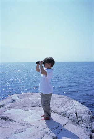 simsearch:700-00151974,k - Boy Using Binoculars on Rock near Water Stock Photo - Rights-Managed, Code: 700-00049743