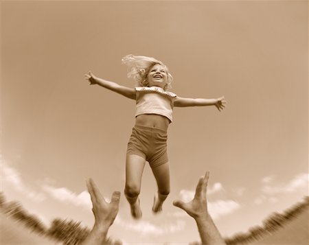 Girl Being Thrown in Air Stock Photo - Rights-Managed, Code: 700-00040659