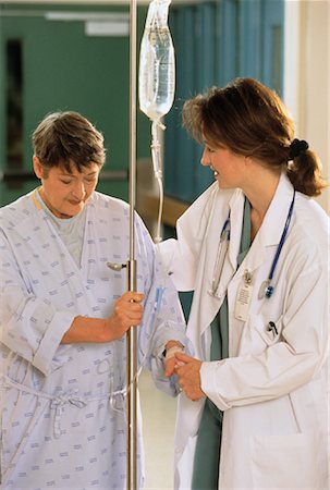 Female Doctor and Patient Talking In Hospital Stock Photo - Rights-Managed, Code: 700-00041003