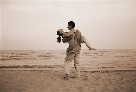 simsearch:700-00046307,k - Man Carrying Woman on Beach Stock Photo - Rights-Managed, Code: 700-00041096