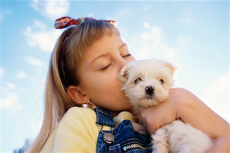 simsearch:700-00095769,k - Girl Kissing Puppy Outdoors Stock Photo - Rights-Managed, Code: 700-00041486
