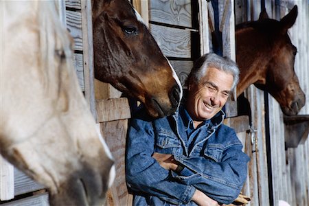 ranchers - Mature Man with Horses Foto de stock - Con derechos protegidos, Código: 700-00041533