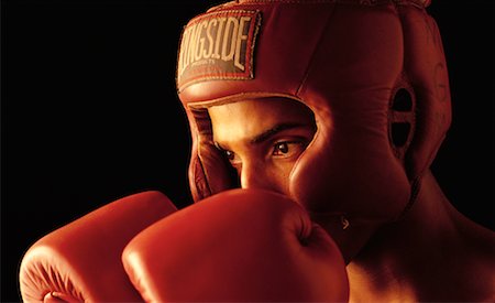 Portrait of Male Boxer Wearing Helmet and Boxing Gloves Stock Photo - Rights-Managed, Code: 700-00041649