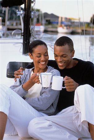Couple Toasting with Mugs on Boat Stock Photo - Rights-Managed, Code: 700-00042190