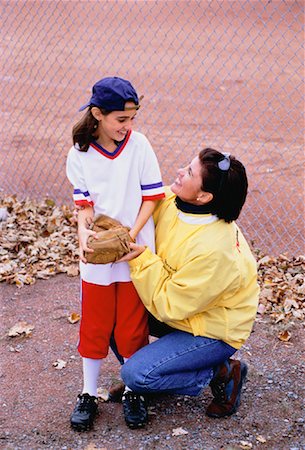 Little girls in baseball uniforms Stock Photos - Page 1 : Masterfile