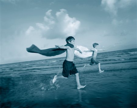 Boys in Swimwear, Running on Beach with Capes Stock Photo - Rights-Managed, Code: 700-00042615